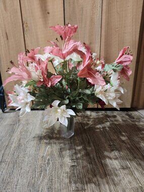 vintage floral arrangement of artificial flowers in small vase